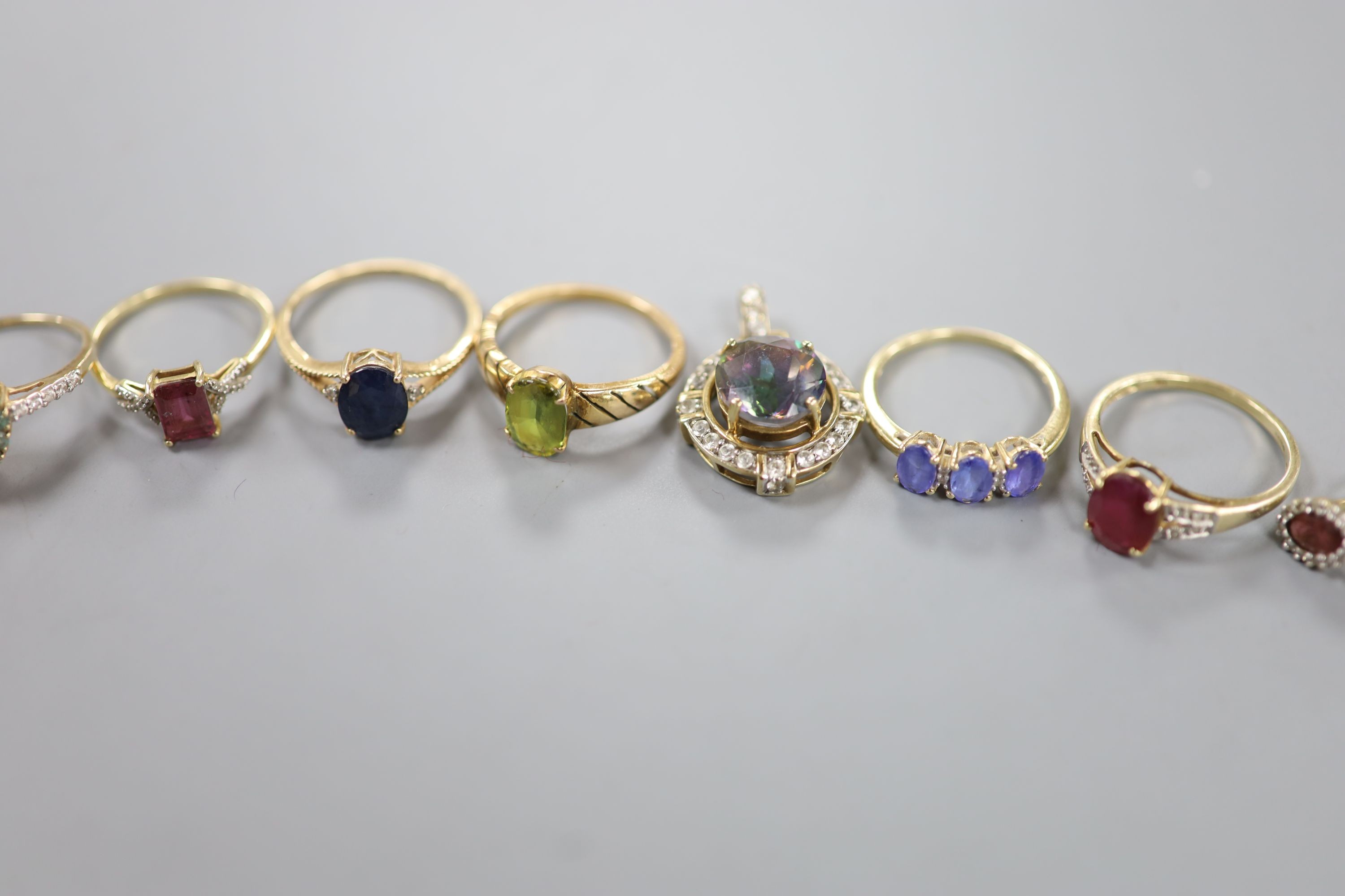 Six assorted modern 9ct gold and gem set dress rings, a pair of 9ct and gem set earrings and two 9ct gold and gem set pendants, gross weight 22.2 grams, a yellow metal and olivine? ring, gross 3.7 grams and a pair of 925